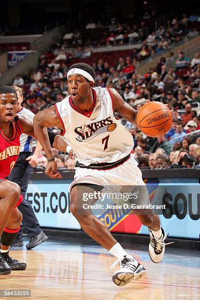 John Salmons of the Philadelphia 76ers drives against Joe Johnson of the Atlanta Hawks on December 14, 2005 at the Wachovia Center in Philadelphia,...