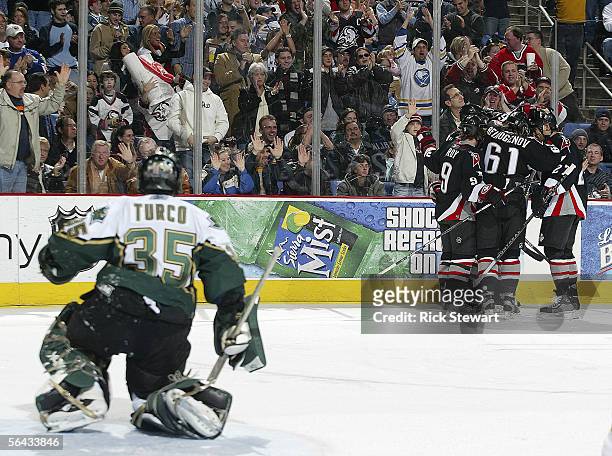 Buffalo Sabres players celebrate their third goal of the game scored by Derek Roy against the Dallas Stars on December 14, 2005 at HSBC Arena in...