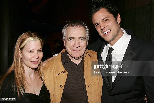 Actor Brian Cox poses with Johnny Knoxville and wife Melanie Clapp at the Hollywood premiere of Fox Searchlight Pictures' "The Ringer" after party...