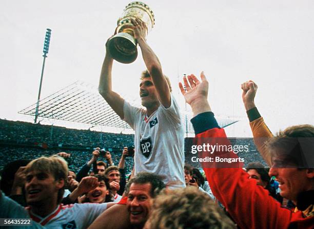 Thomas von Heesen of Hamburg and team mates celebrate after winning the DFB German Cup final match between Hamburger SV and Stuttgarter Kickers at...