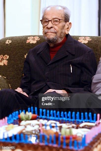 Egyptian novelist and 1988 Nobel prize winner in Literature, Naguib Mahfouz, celebrates his 94th birthday at a hotel in Cairo late 14 December 2005....