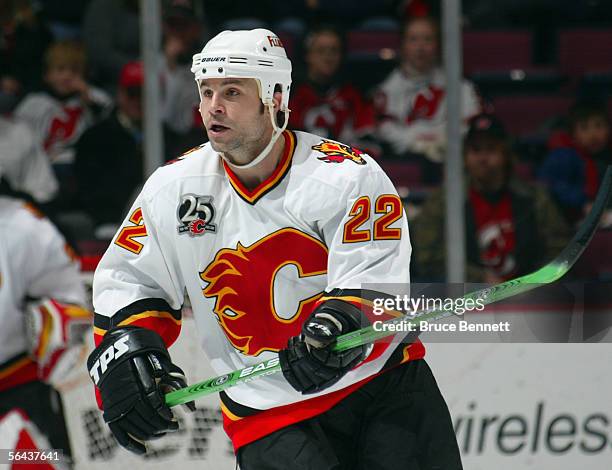 Daymond Langkow of the Calgary Flames skates against the New Jersey Devils at Continental Airlines Arena on December 7, 2005 in East Rutherford, New...