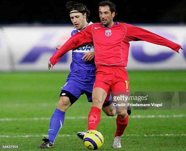 Niko Kovac of Hertha Berlin tussles for the ball with Gabriel Bostina of Bucharest during the UEFA Cup Group C match between Hertha BSC Berlin and FC...