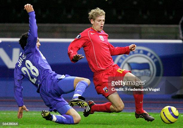 Sofian Chahed of Hertha Berlin tussles for the ball with Mihai Nesu of Bucharest during the UEFA Cup Group C match between Hertha BSC Berlin and FC...