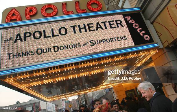 Former U.S. President Bill Clinton shakes hands outside Harlem's Apollo Theater during a celebration of the first phase of restoration of the...