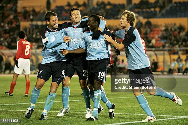 Dwight Yorke of Sydney FC is congratulated by team-mates Mark Rudan , Sasho Petrovski and Iain Fyfe after scoring during the FIFA Club World...