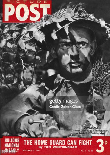 Picture Post cover featuring a member of the British Home Guard in camouflage at the organisation's training centre at Osterley Park, near London,...