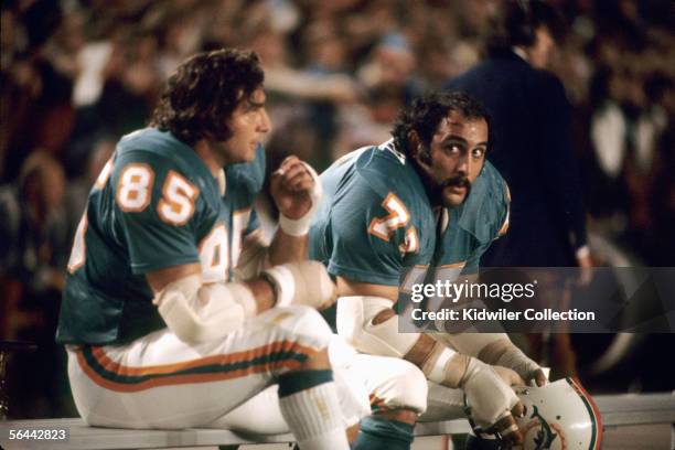 Linebacker Nick Buoniconti and defensive lineman Manny Fernandez, of the Miami Dolphins, on the bench during a game against the St. Louis Cardinals...