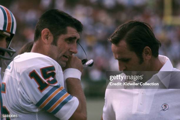 Quarterback Earl Morrall and head coach Don Shula, of the Miami Dolphins, on the sidelines during a game against the New England Patriots on November...