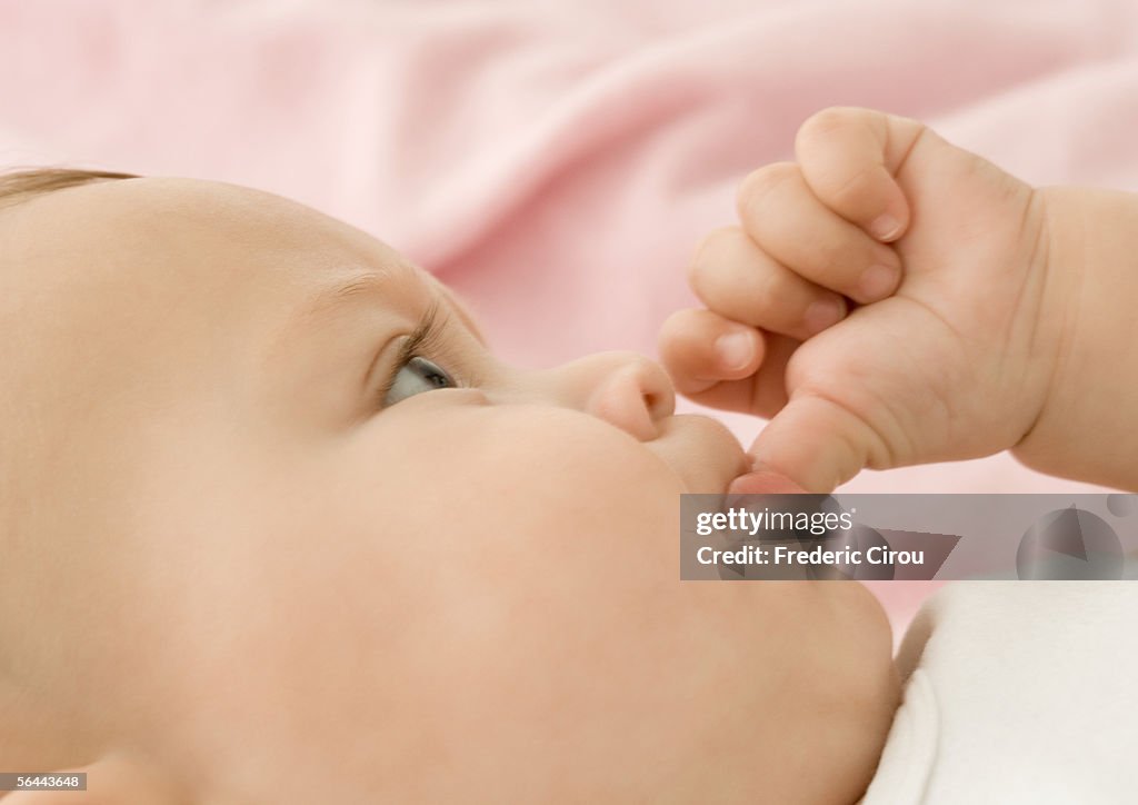 Baby sucking thumb, close-up