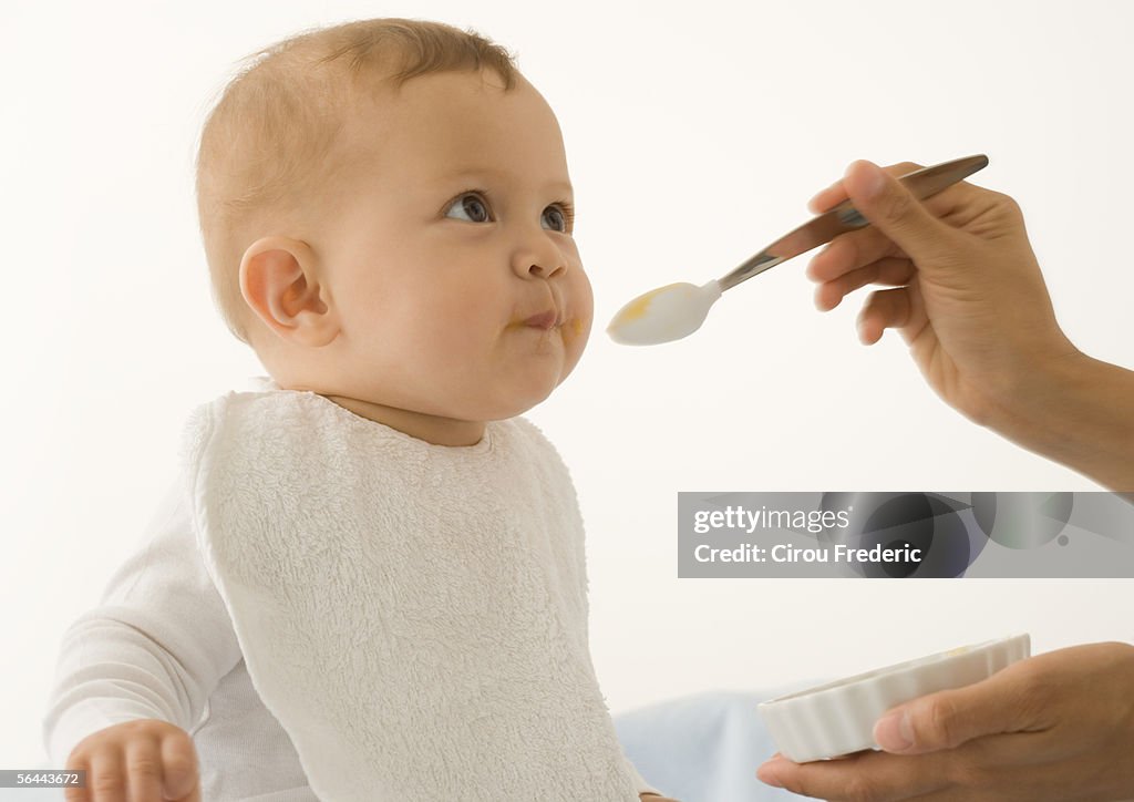 Baby being fed