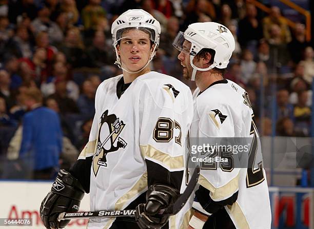 Sidney Crosby and Maxime Talbot of the Pittsburgh Penguins look on during a break in NHL game action against the St. Louis Blues on December 13, 2005...