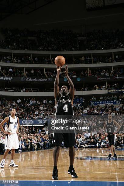 Michael Finley of the San Antonio Spurs shoots a free throw against the Dallas Mavericks during the game at American Airlines Arena on December 1,...