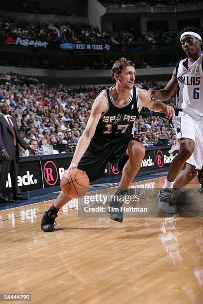 Brent Barry of the San Antonio Spurs drives around Marquis Daniels of the Dallas Mavericks during the game at American Airlines Arena on December 1,...