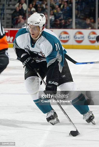 Marcel Goc of the San Jose Sharks looks to make a play from the left wing against the Buffalo Sabres during their NHL game on December 2, 2005 at...