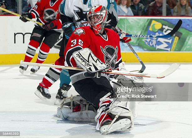 Goaltender Mika Noronen of the Buffalo Sabres looks back for the puck during their NHL game against the San Jose Sharks on December 2, 2005 at HSBC...