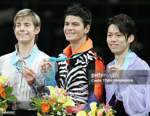 Accompanied by second-placed Canadian skater Jeffrey Buttle and third-placed Japanese skater Daisuke Takahashi , Stephane Lambiel of Switzerland...