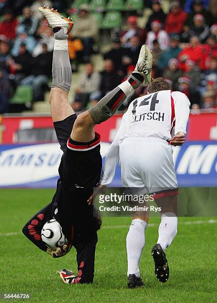 Goalkeeper Robert Enke of Hanover catches the ball as his team mate Hanno Balitsch looks on during the Bundesliga match between Bayer Leverkusen and...