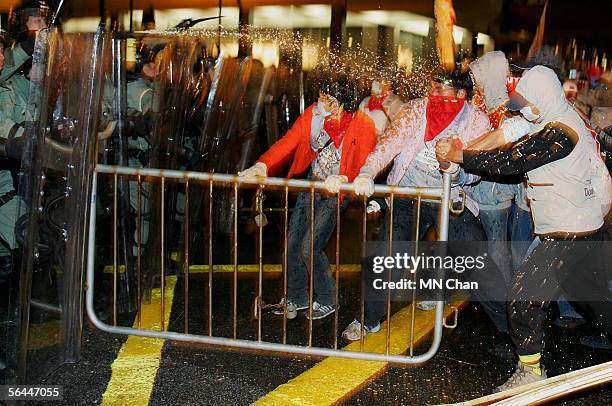 Demonstrators clash with riot police during a protest against the sixth World Trade Organization ministerial meeting December 17, 2005 in Hong Kong....