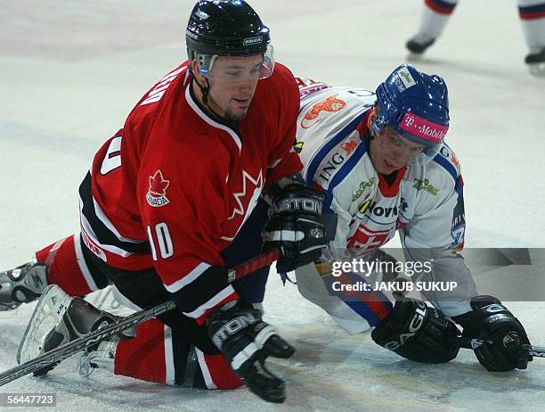 Brandon Reid of Canada fights with Slovakian Martin Bartek during the International hockey tournament LOTO CUP 2005 between team Slovakia and team...