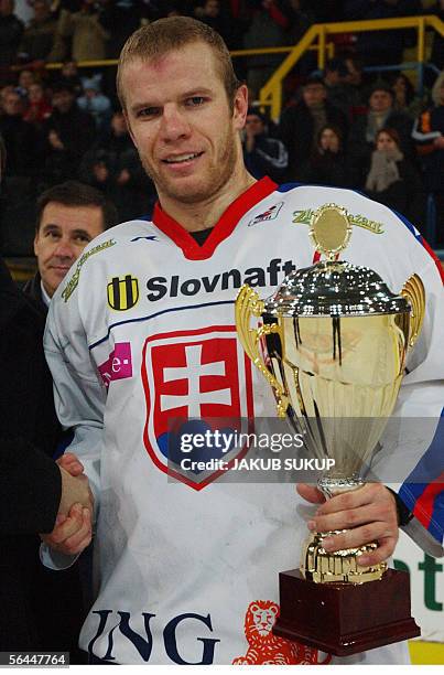 Captain of Slovak national hockey team Lubos Bartecko poses with the ers'trophy during the International hockey tournament LOTO CUP 2005 between team...