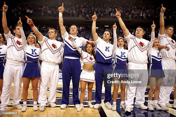Cheerleaders for the of the Kentucky Wildcats and the Louisville Cardinals come together and sing "My old Kentucky Home" after the game at Rupp Arena...