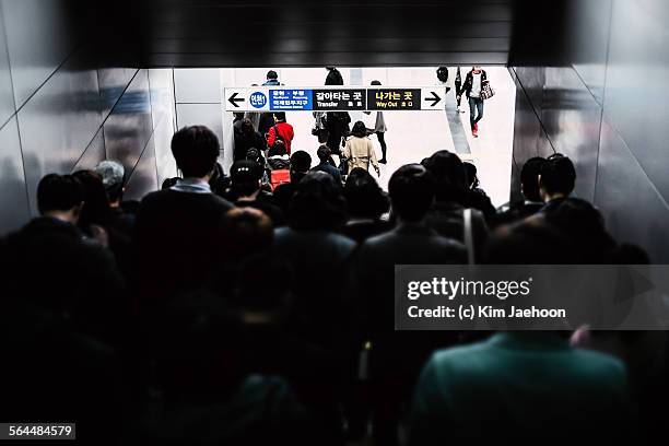 people walking down stairs in subway station. - korean language stock pictures, royalty-free photos & images