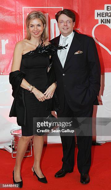 Peter Schwenkow and his wife Inga Griese-Schwenkow arrive at the "Ein Herz Fuer Kinder" television charity gala at the Axel Springer Halle December...