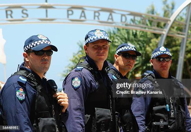 Police officers patrol the beach at Surfers Paradise December 18, 2005 on the Gold Coast, Australia. The police presence was heightened in the area...