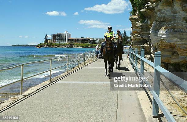Mounted police patrol between Cronulla and North Cronulla Beach December 18, 2005 in Sydney, Australia. 1500 police are patroling Sydney's Southern...