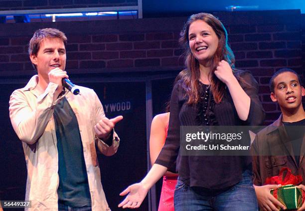 Tom Cruise and Katie Holmes on stage at the Y100.7 Jingle Ball on December 17, 2005 in Sunrise, Florida.
