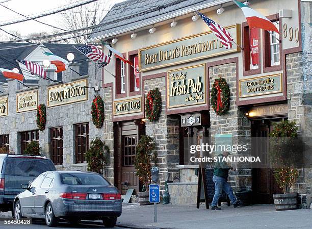 Yonkers, UNITED STATES: NUMBER OF ILLEGAL IRISH IMMIGRANTS IN US DWINDLING: A man walks into Rory Dolan's Restaurant Bar, which flies the Irish...