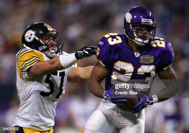 Michael Bennett of the Minnesota Vikings is stopped by James Farrior of the Pittsburgh Steelers on December 18, 2005 at the Hubert H.Humphrey...