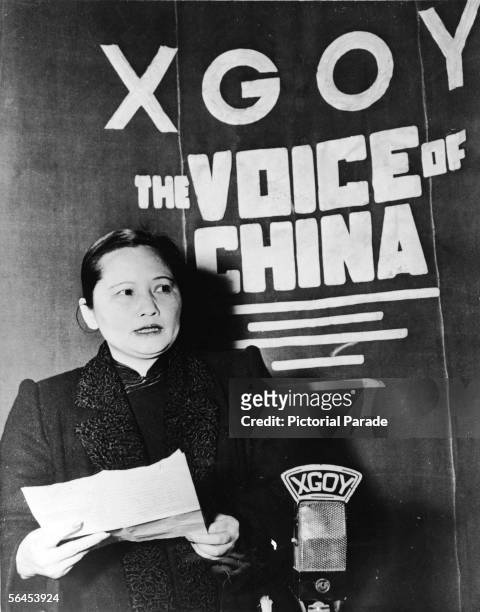 Chinese political figure Ching-ling Soong , better known as Madame Sun Yat-sen, holds a piece of paper in her hands as she addresses the people of...