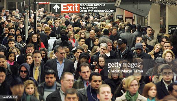 Commuters pass through Grand Central Terminal during morning rush hour December 19, 2005 in New York City. Transit workers continue to negotiate a...