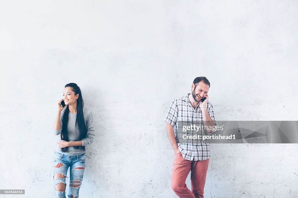 Young couple talking on the phone