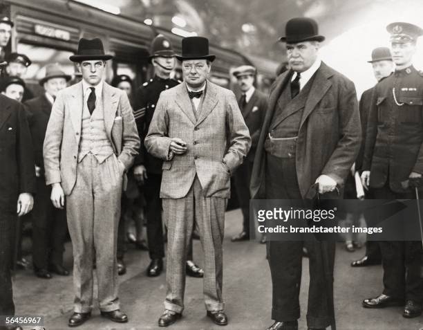 Winston Churchill , English politician with his son Randolph and Lord Derby on an election rally for the Conservative Party in Liverpool....