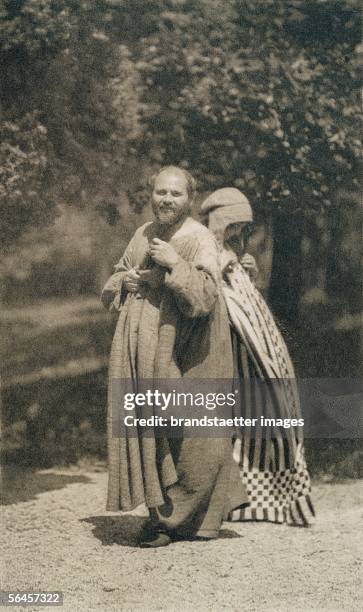 Gustav Klimt and Emilie Floege in dresses, presumably designed by Kolo Moser. Garden of Klimt?s studio, Vienna, about 1905/06. Vintage print. 18,3 :...