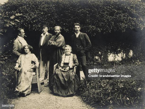 Gustav Klimt, Emilie Floege and her mother Barbara with friends in the garden of the Oleander villa in Kammer at the Attersee lake. Austria....