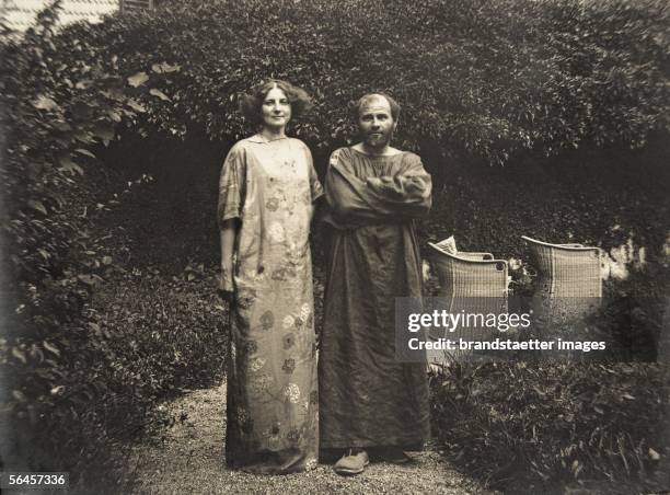 Gustav Klimt and Emilie Floege in a dress with floral pattern in the garden of the Oleander villa in Kammer at the Attersee lake. Photography, 1910....