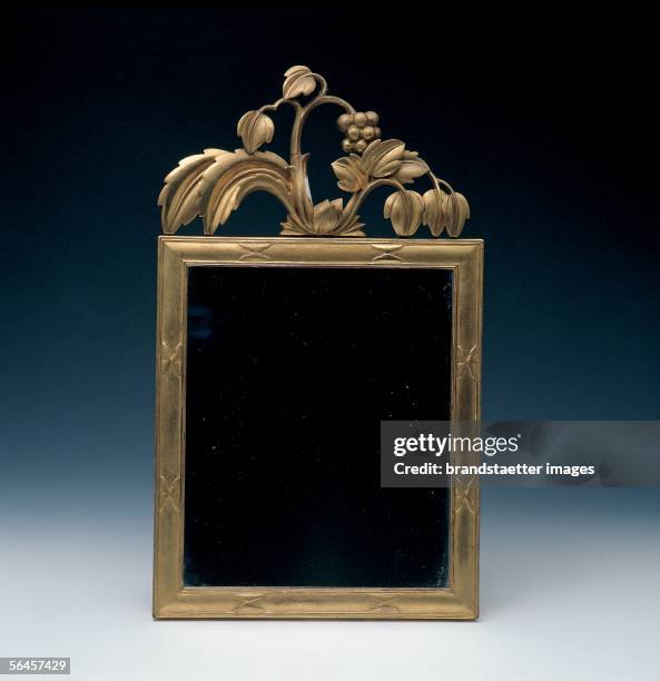 Mirror with top part. 1922. Carved linden, gold-plated. By the Wiener Werkstaette, made by May Welz, Friedrich Nerold . [Spiegelrahmen mit Aufsatz....