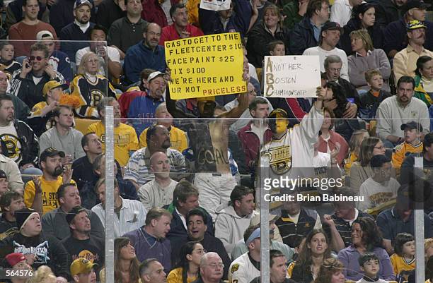 Boston Bruins' fans hold up signs during game 5 of the Stanley Cup play-offs against the Montreal Canadiens at the Fleet Center in Boston,...