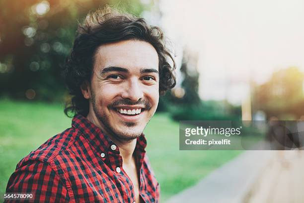 smiling young man - beard men street stock pictures, royalty-free photos & images