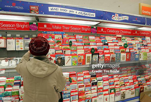 Florence Papak shops for Christmas cards in a Kmart store December 19, 2005 in Norridge, Illinois. Consumers are visiting stores in search of...