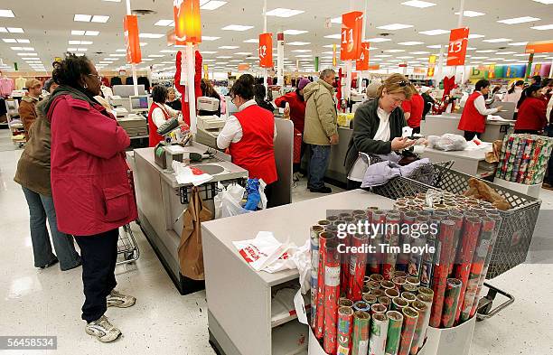 Shoppers pay for their purchases at a Kmart store December 19, 2005 in Norridge, Illinois. Consumers are visiting stores in search of last-minute...