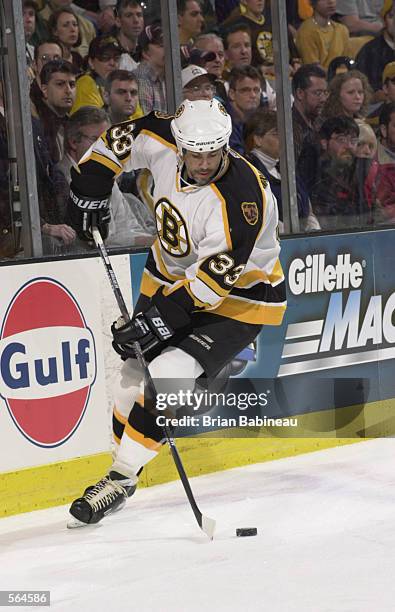 Defenseman Jeff Norton of the Boston Bruins starts up ice with the puck against the Montreal Canadiens during game 5 of the Stanley Cup play-offs at...