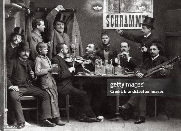 The Schrammel quartet at a wine tavern in Vienna: The brothers Johann and Joseph Schrammel with violines, guitarist Anton Strohmayer and clarinetist...