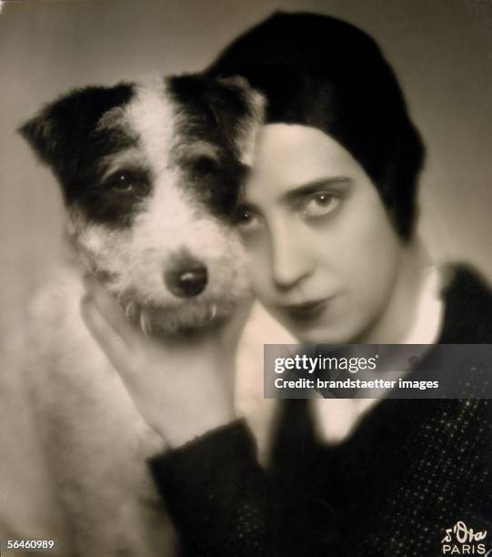 Mme Schiaparelli / maison Schiaparelli: Elsa Schiaparelli with her dog . Photography. Vienna. About 1926. [Mme Schiaparelli / maison Schiaparelli:...