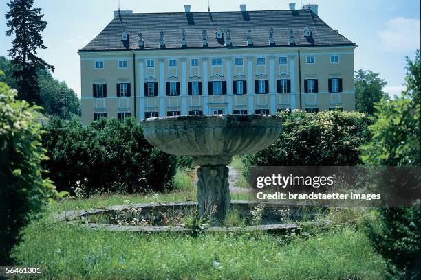 The vase, once used as fountain, decorates the outside staircase in front of Frohsdorf Castle. Lower Austria. Photography. 2000. [Eine Gartenvase,...