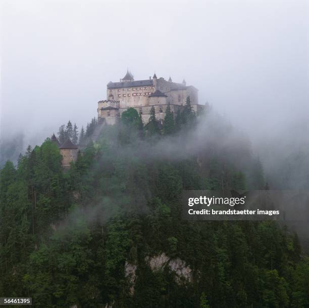 Hohenwerfen castle, Salzburg, in fog. Photography, about 1985. [Burg Hohenwerfen im Nebel. Photographie um 1985]